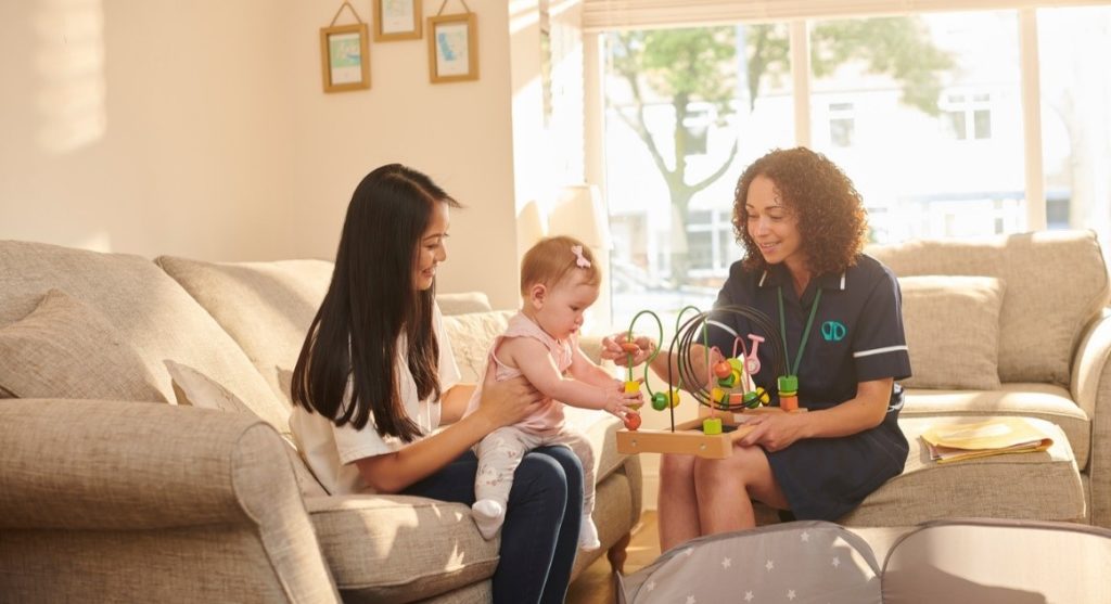 Women playing with a child