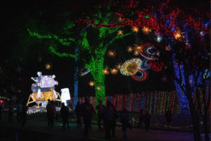 A glowing lunar lander replica lantern lights up the night amongst guests at Space Center Houston’s Galaxy Lights, presented by Wellby Financial (Photo Courtesy of Space Center Houston)