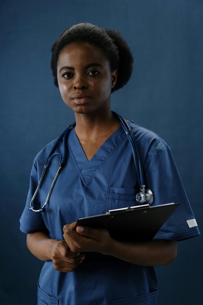 African American woman wearing blue scrubs with statoscope