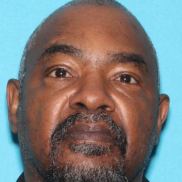 Official alert photograph of Wilford Hughs