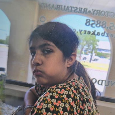 Official alert photograph of Mila Castanon