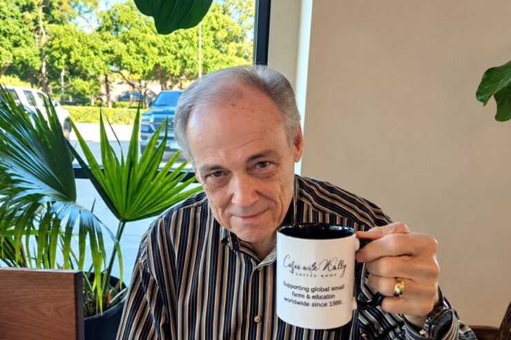 Mr. Wally Wood holding a coffee mug