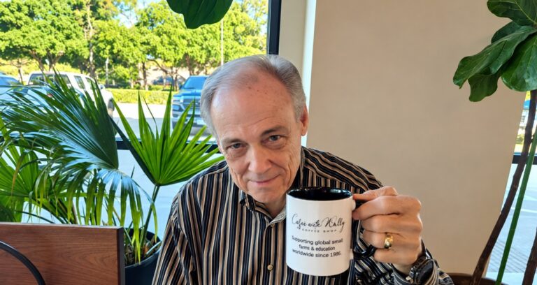 Mr. Wally Wood holding a coffee mug