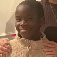 Official missing-person alert photograph of Kenyi Mogga