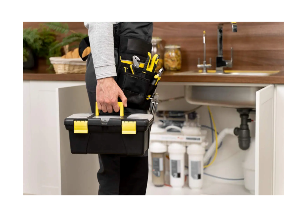 man holding a black and yellow toolbox and wearing a toolbelt with tools